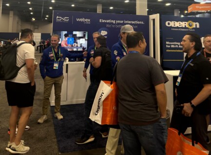 photo of cisco las vegas booth of bucher + suter with customers